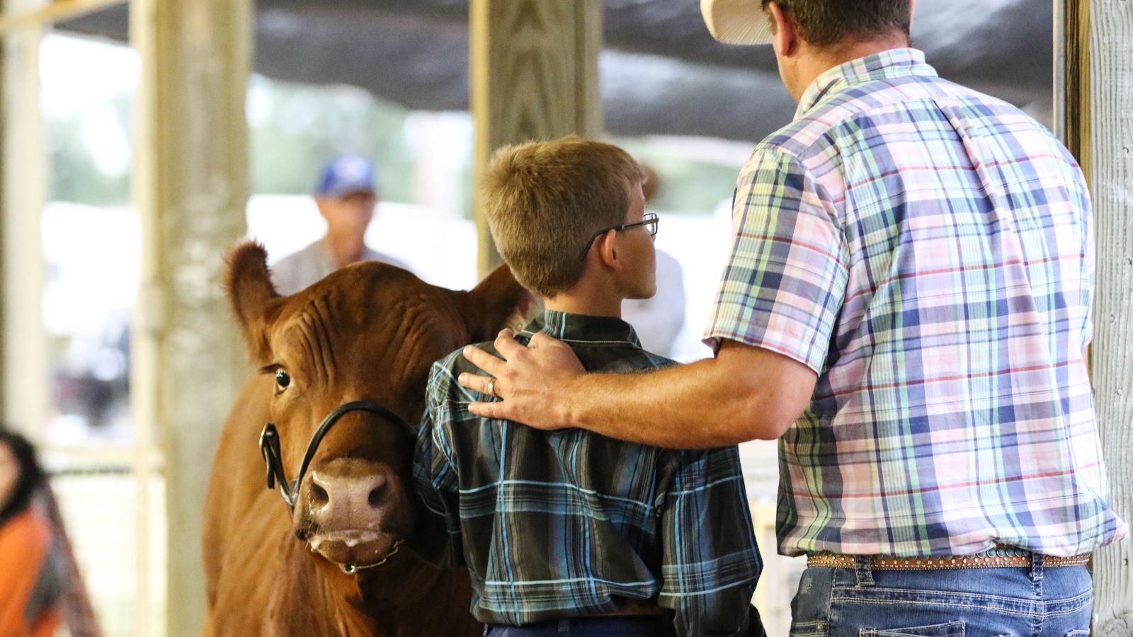 Youth and mentor talking during the county fair